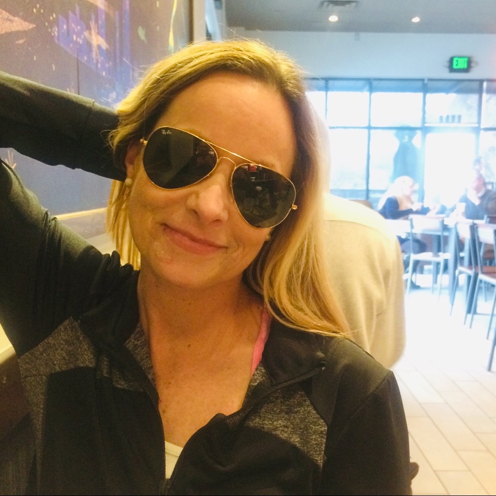 Classic gold-rimmed Ray-Ban Aviator sunglasses